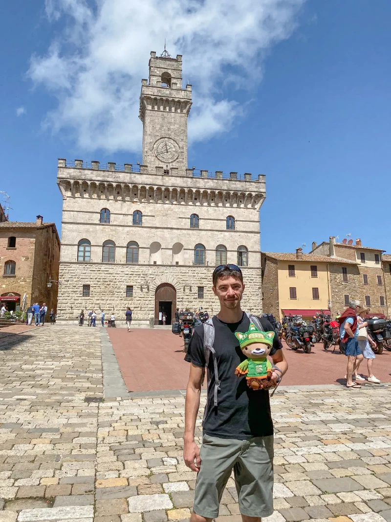 Sumi in front of the main piazza and clock tower in Montepulciano