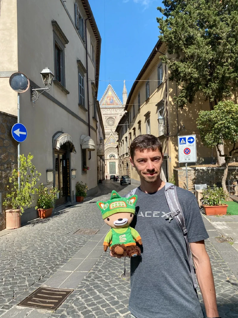 Cobblestone street with Orvieto's Duomo visible at the end