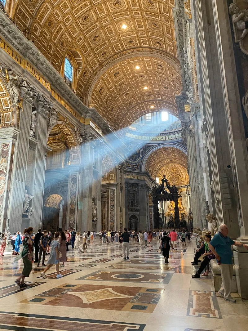 Sunbeams inside St. Peter's Basilica with the baldachin
