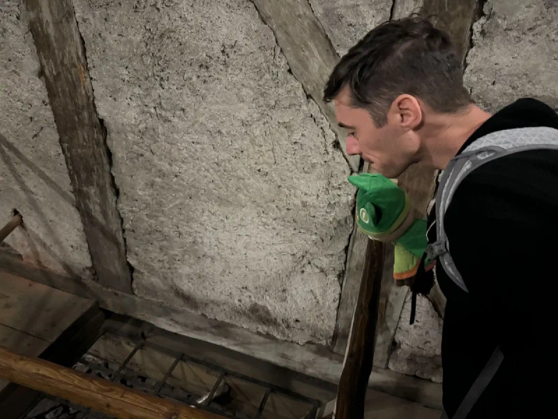 Nicholas climbing the narrow wooden tower stairs