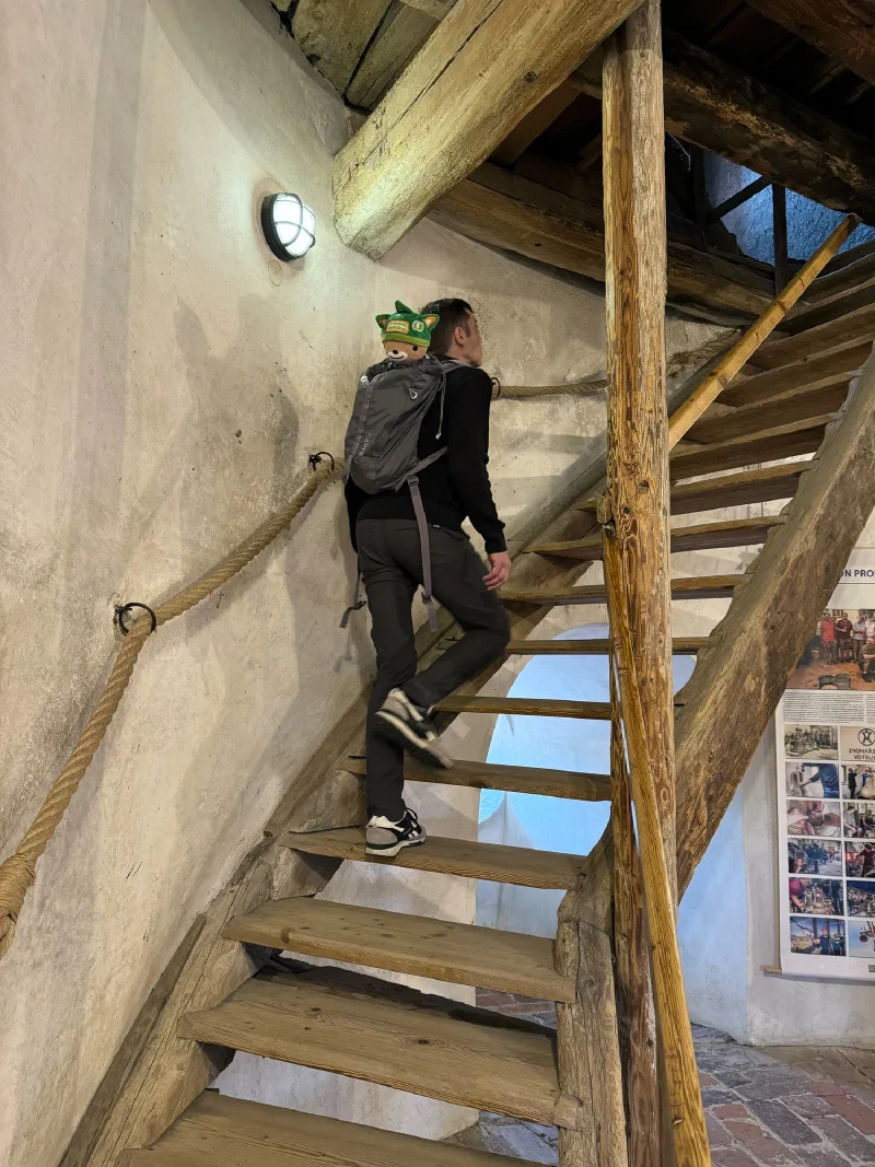 Nicholas and Sumi Bear climbing the steep staircase