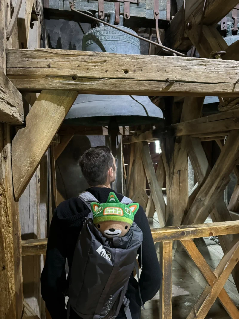 Nicholas and Sumi Bear next to the tower bells