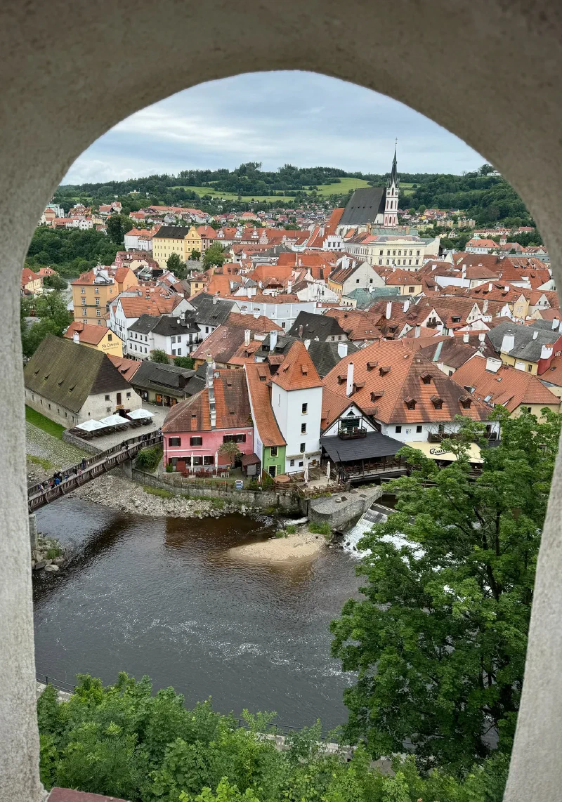View through an arch over the town and river