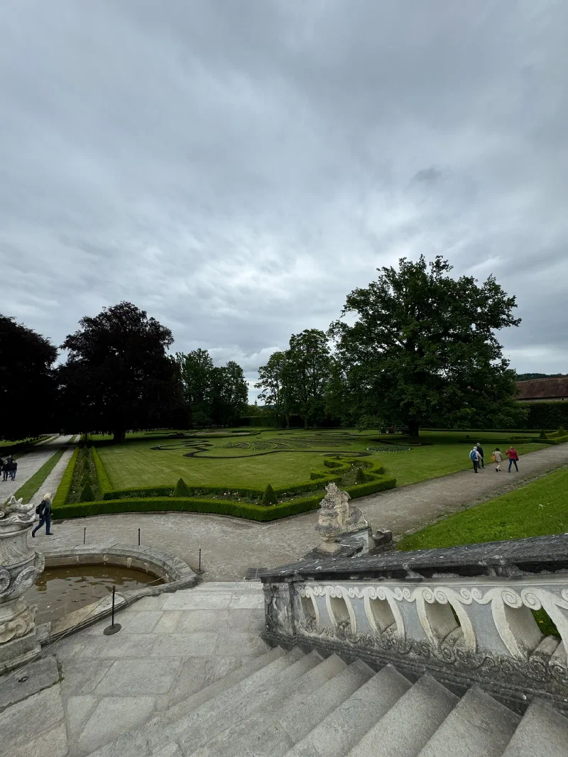 Formal castle gardens with hedges and statues