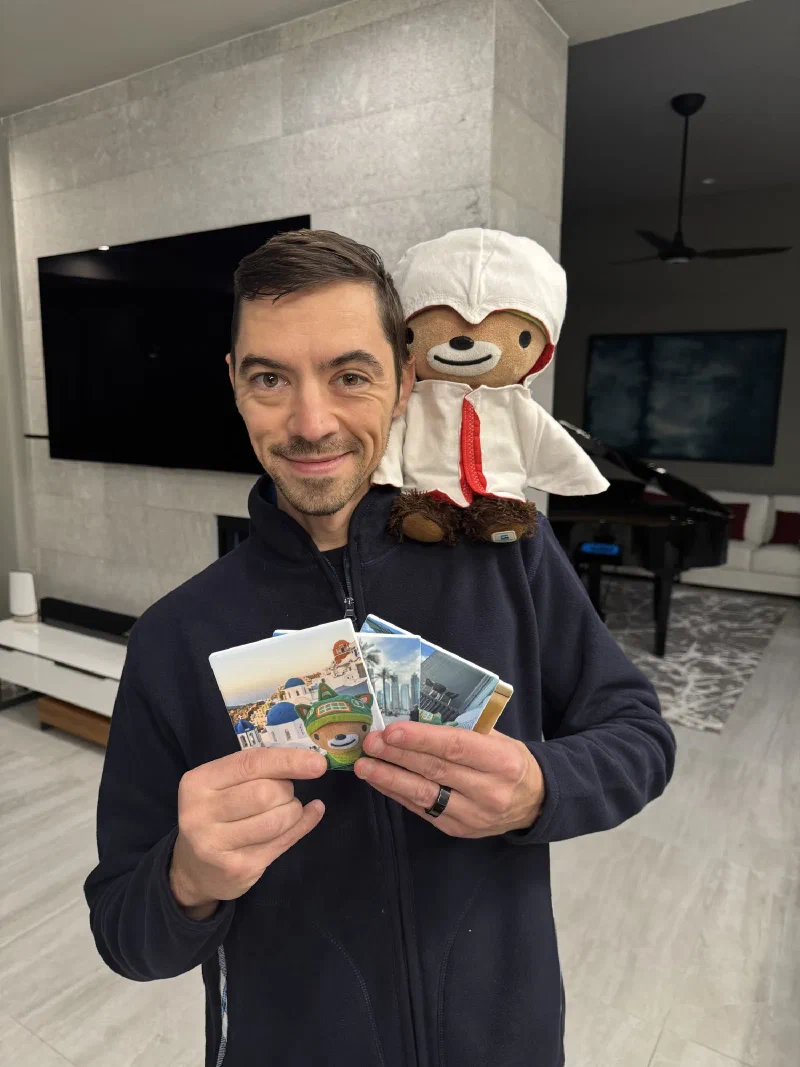 Nicholas holding coasters of me while I supervise from his shoulder in my chef outfit