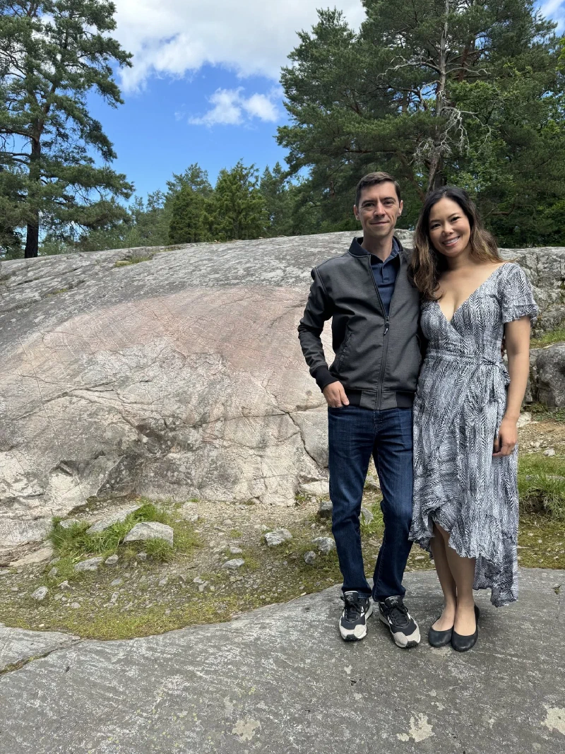 Nicholas and Pokin posing in front of the Sigurd rock carving