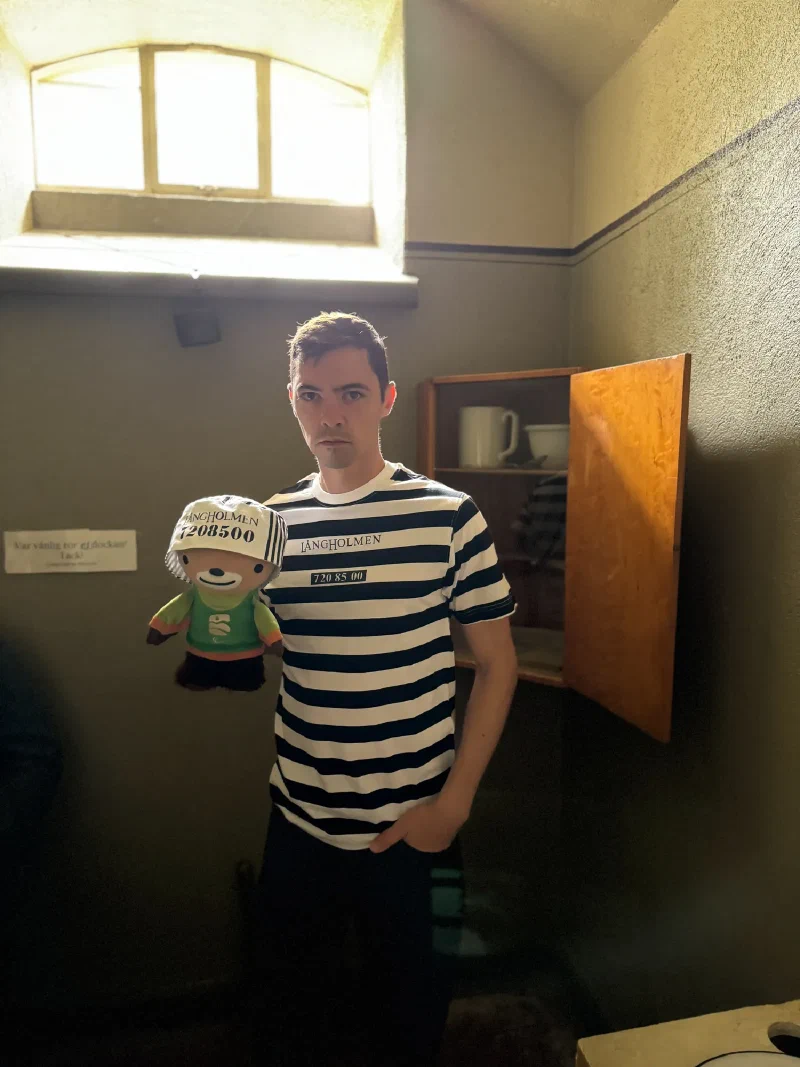 Nicholas and Sumi in a preserved cell with arched window and wall cabinet