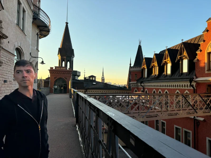 Nicholas on the elevated walkway near Maria Hissen in golden evening light