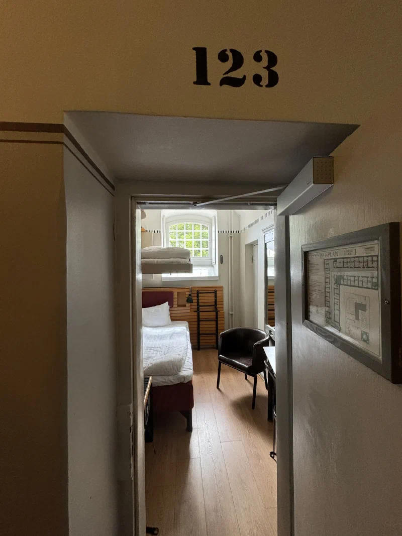View into room 123 from doorway showing room number and floor plan