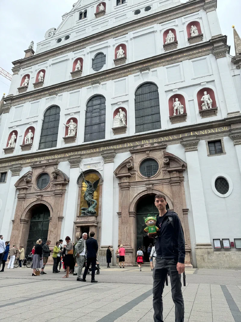 Nicholas holding Sumi in front of St. Michael's Church facade