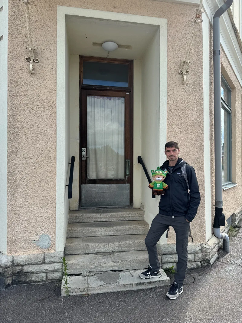 Nicholas and Sumi in front of the old barbershop building in Laxå