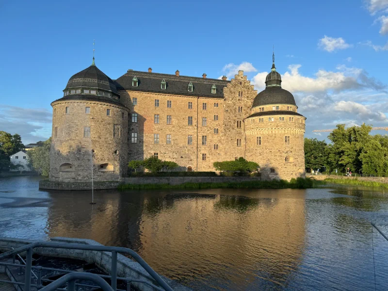 Örebro Castle at golden hour rising from the water