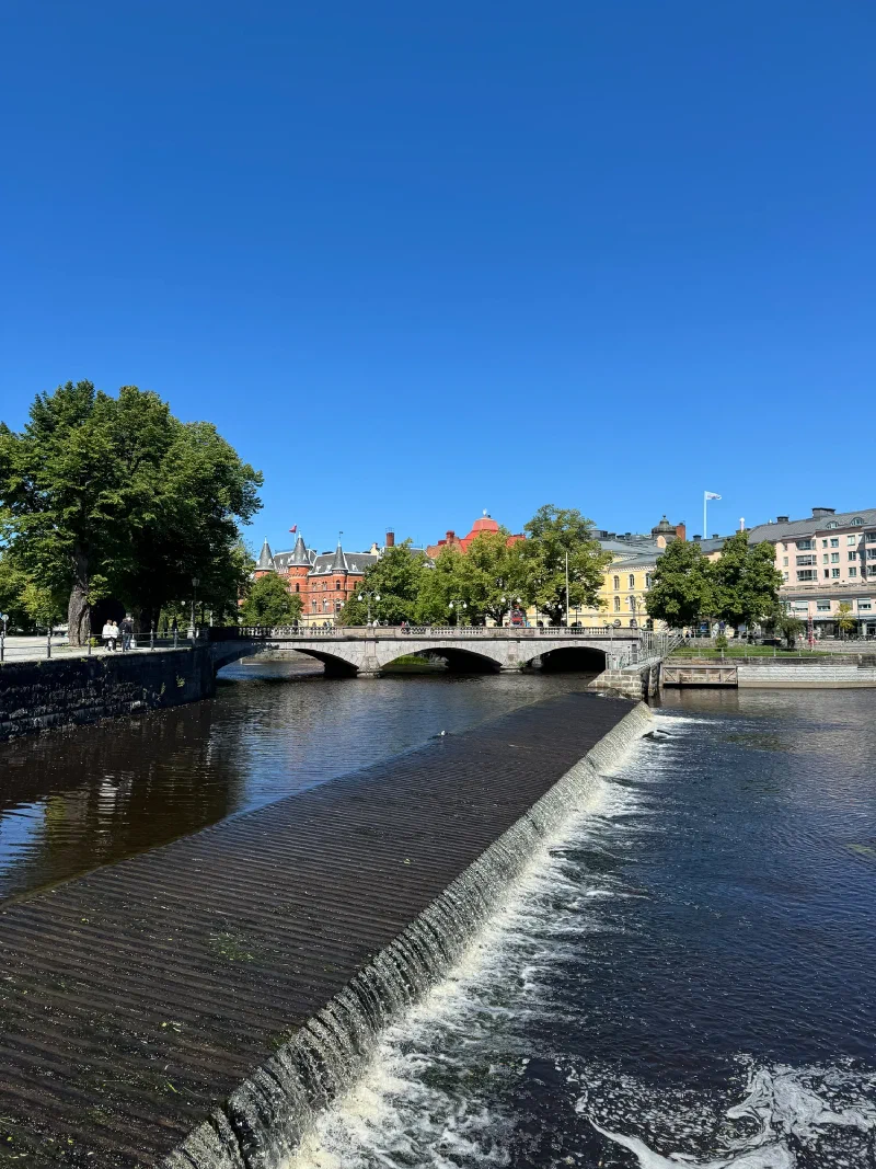 River view of Örebro Castle with waterfall and bridge