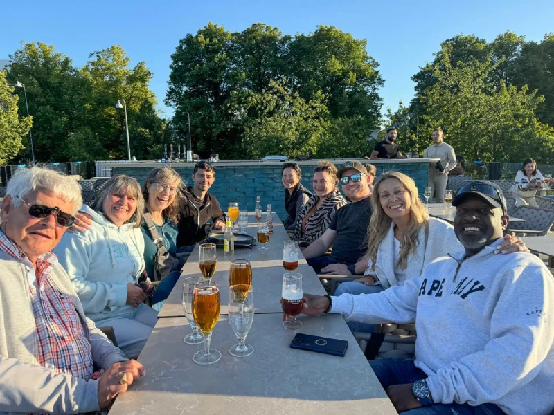 Group dinner on rooftop with Swedish relatives including cousin Karin