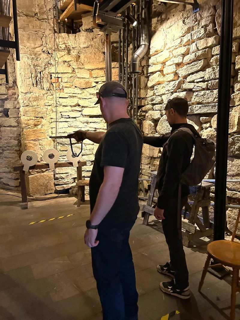 Nicholas and Adam firing crossbows again