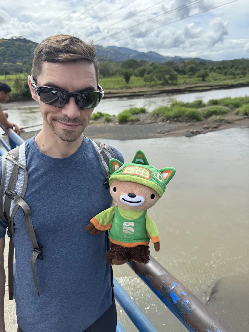 Nicholas holding me on a bridge over a river full of crocodiles