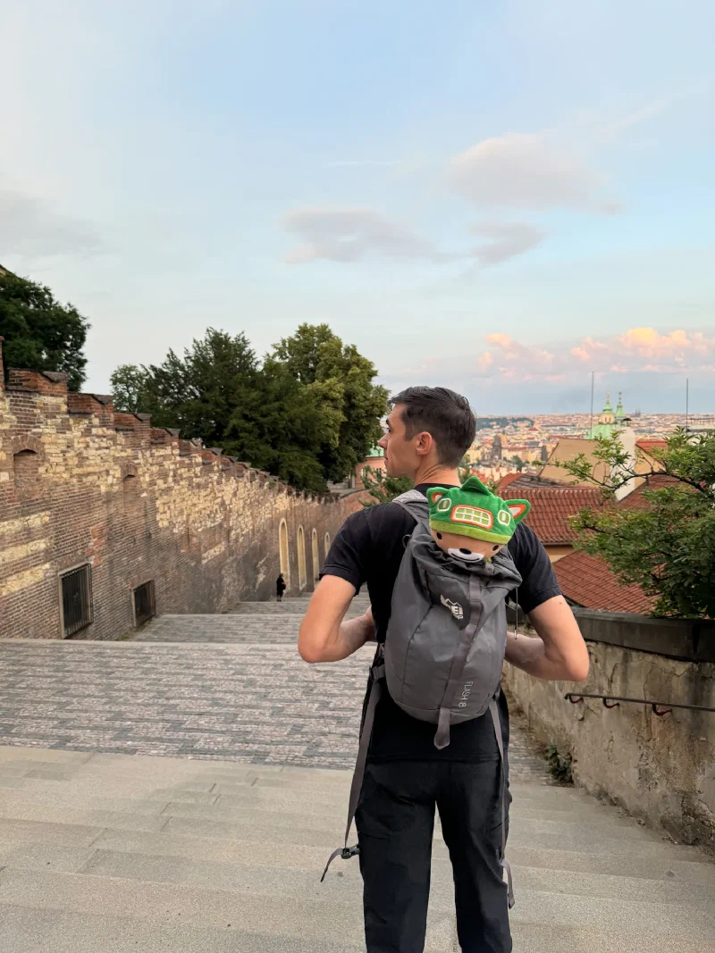 Nicholas walking down the Old Castle Stairs with Sumi Bear in his backpack