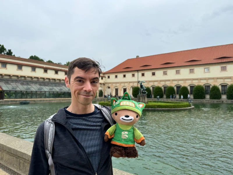 Nicholas with Sumi Bear by the garden pond