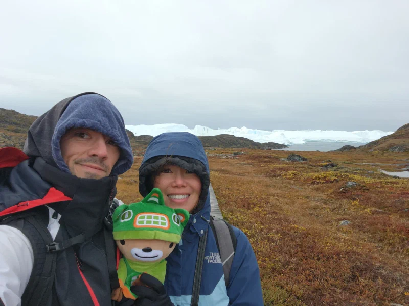 Sumi with Nicholas and Pokin on the Greenland tundra with icebergs