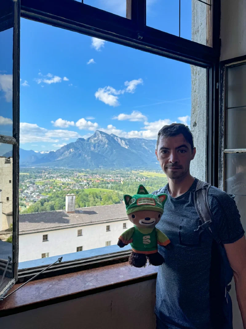 Sumi in a fortress window looking south toward Untersberg mountain