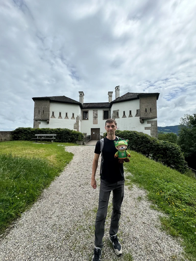 Nicholas and Sumi Bear at a small white castle with turrets