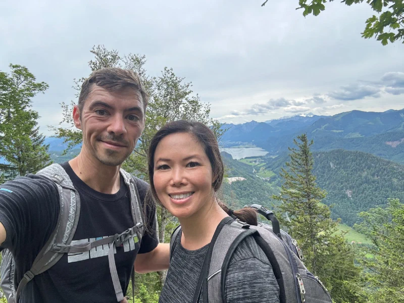 Selfie on the scramble descent with limestone cliffs and lake below