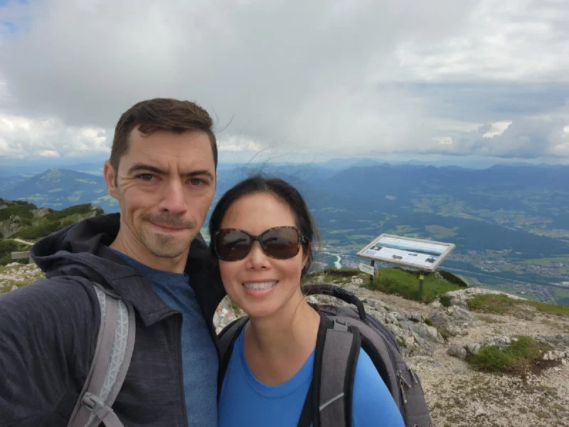Selfie at Untersberg viewpoint with valley and rain in distance
