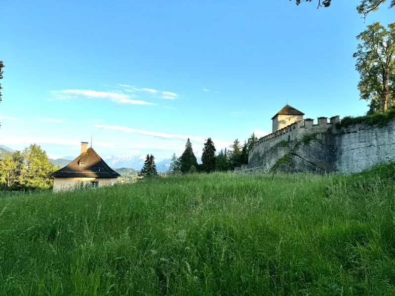 Historic turret and meadow along the fortress walls