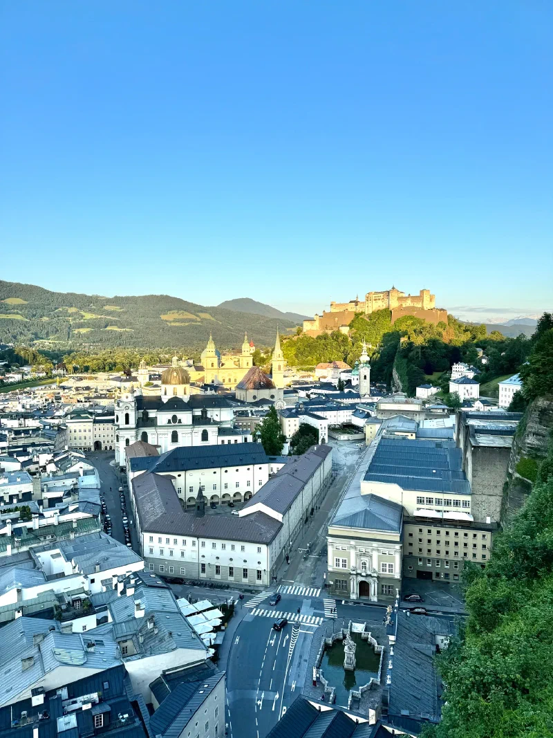 Panorama of Salzburg Old Town with Hohensalzburg glowing at golden hour
