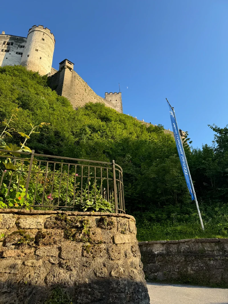 Hohensalzburg Fortress from below with moon visible