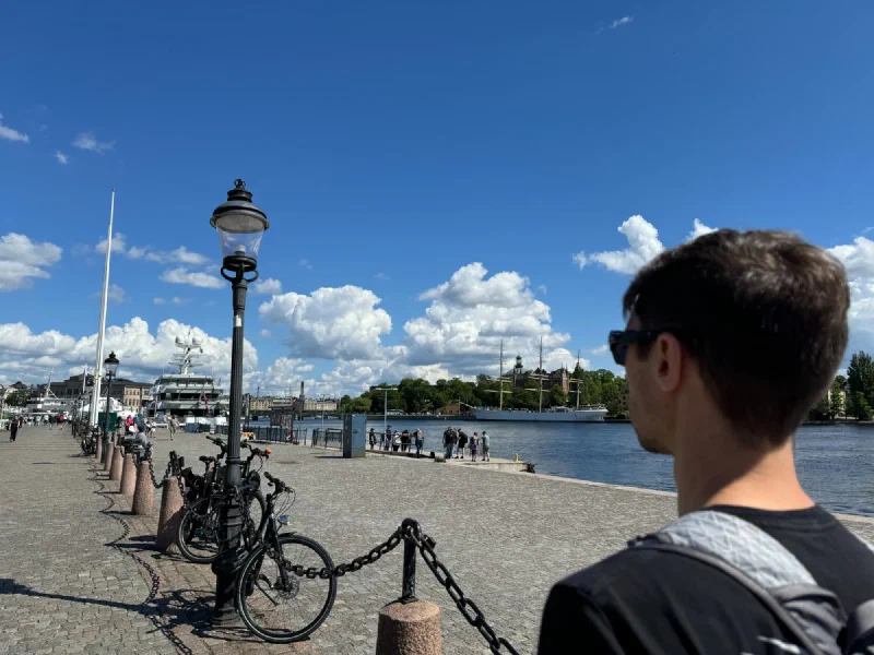 Nicholas looking over Stockholm waterfront promenade