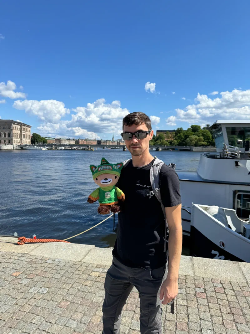 Nicholas holding Sumi on Stockholm waterfront