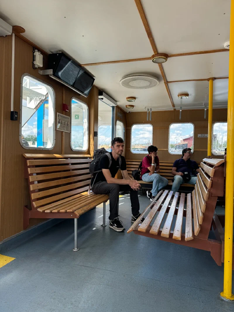 Nicholas sitting inside ferry cabin