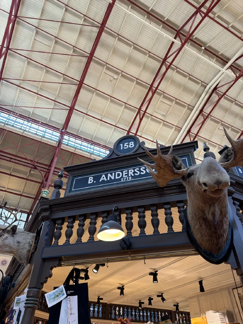 Interior of Östermalm Market Hall with moose head at B. Andersson stall