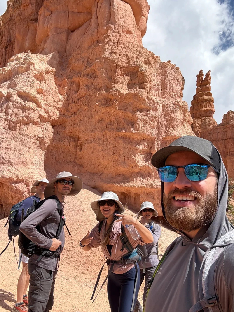 Group selfie at the base of the hoodoos