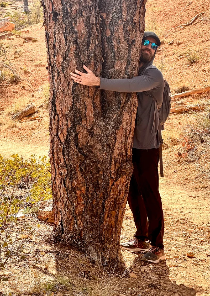 Bruce hugging a ponderosa pine