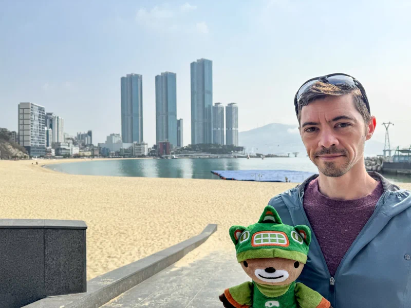 Busan beach with skyscrapers across the water