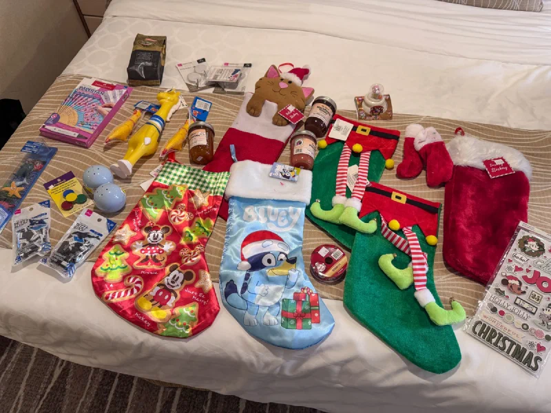Christmas stockings and gag gifts spread across the cabin bed