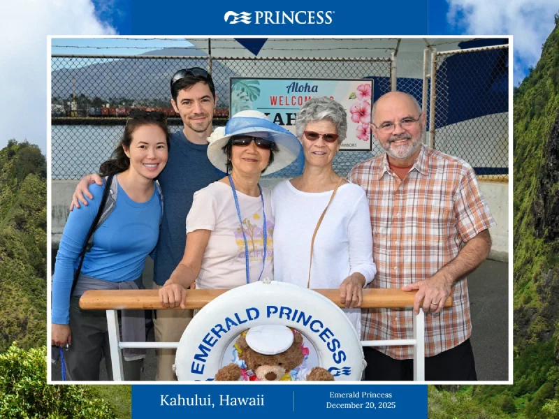 Official Princess Cruises group photo at Kahului with a bear in a sailor cap inside the life ring