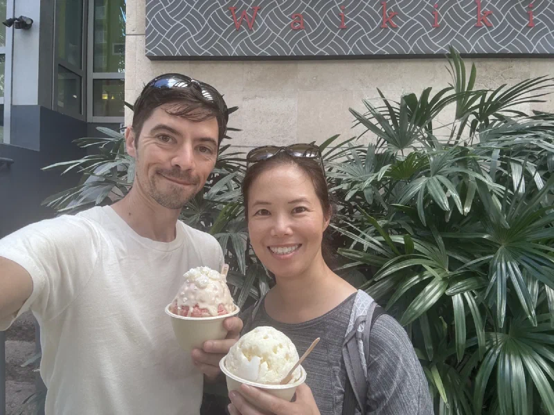 Nicholas and Pokin holding shave ice in Waikiki