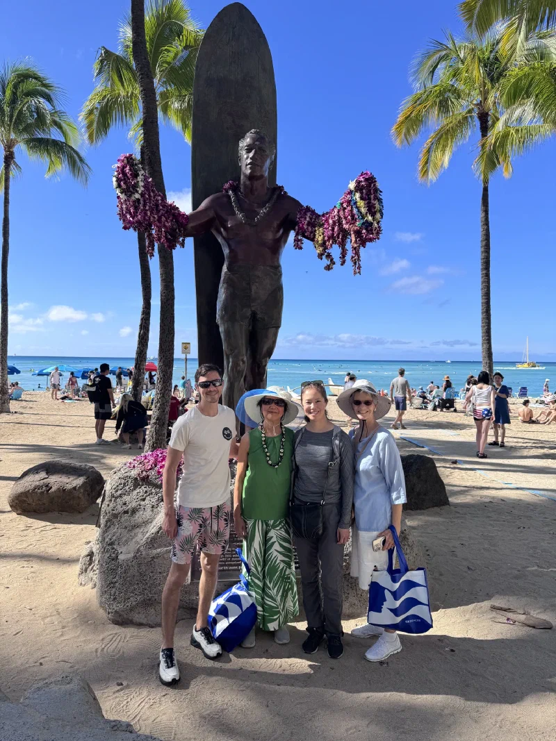 Group photo at Waikiki Beach in front of Duke Kahanamoku statue