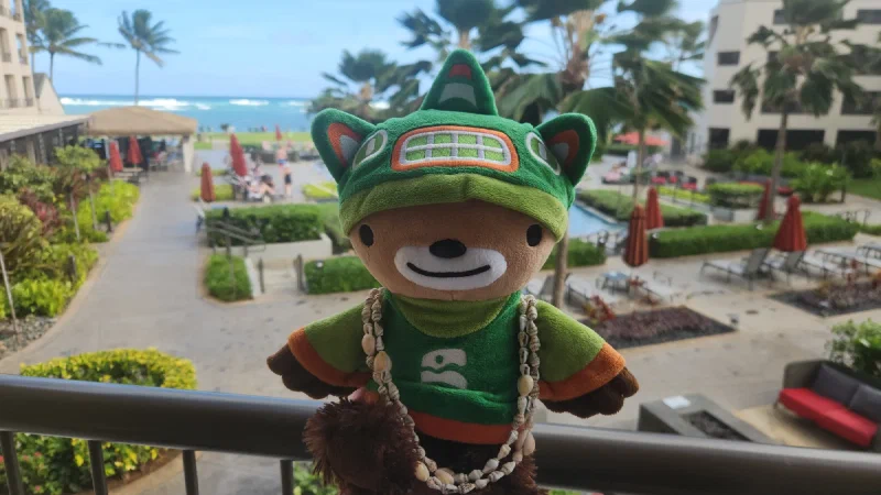 Sumi on the resort balcony overlooking the beach