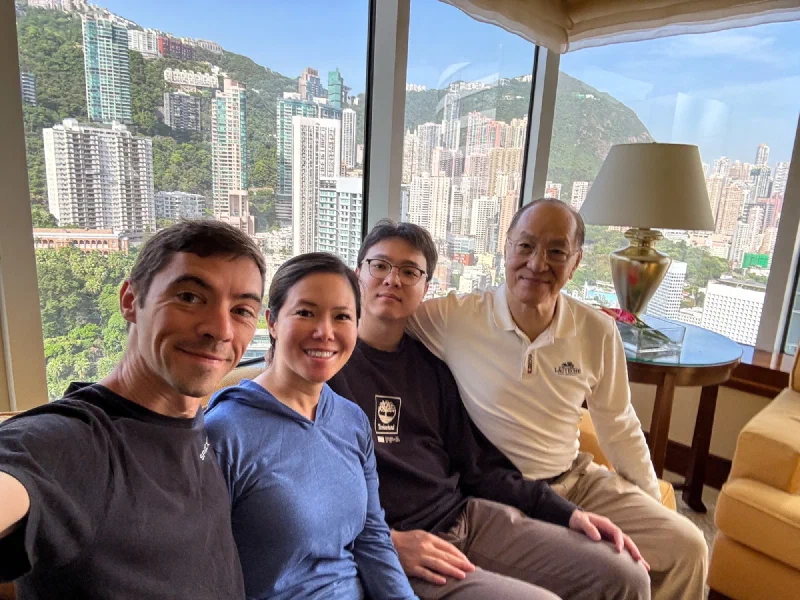 Nicholas, Pokin, her dad, and Pokong selfie with Hong Kong skyline