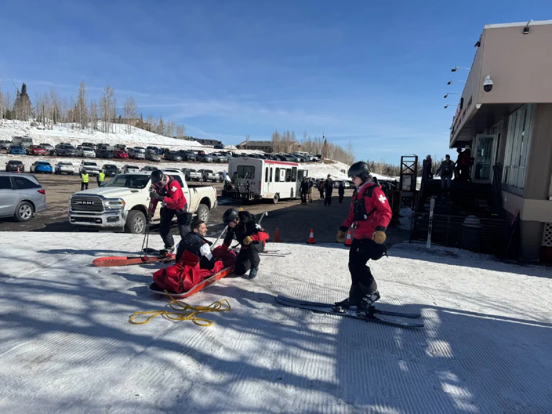Nicholas on a ski patrol rescue toboggan