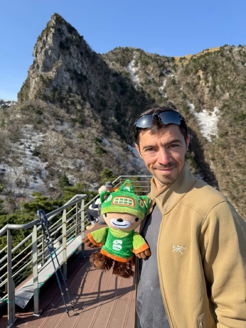Sumi with Nicholas in front of the volcanic rock spires near the summit