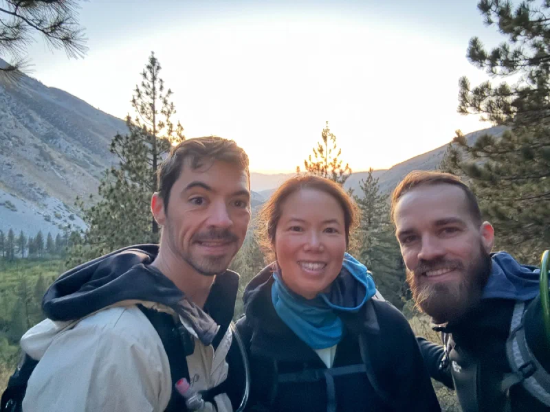 Group selfie at dawn on the trail