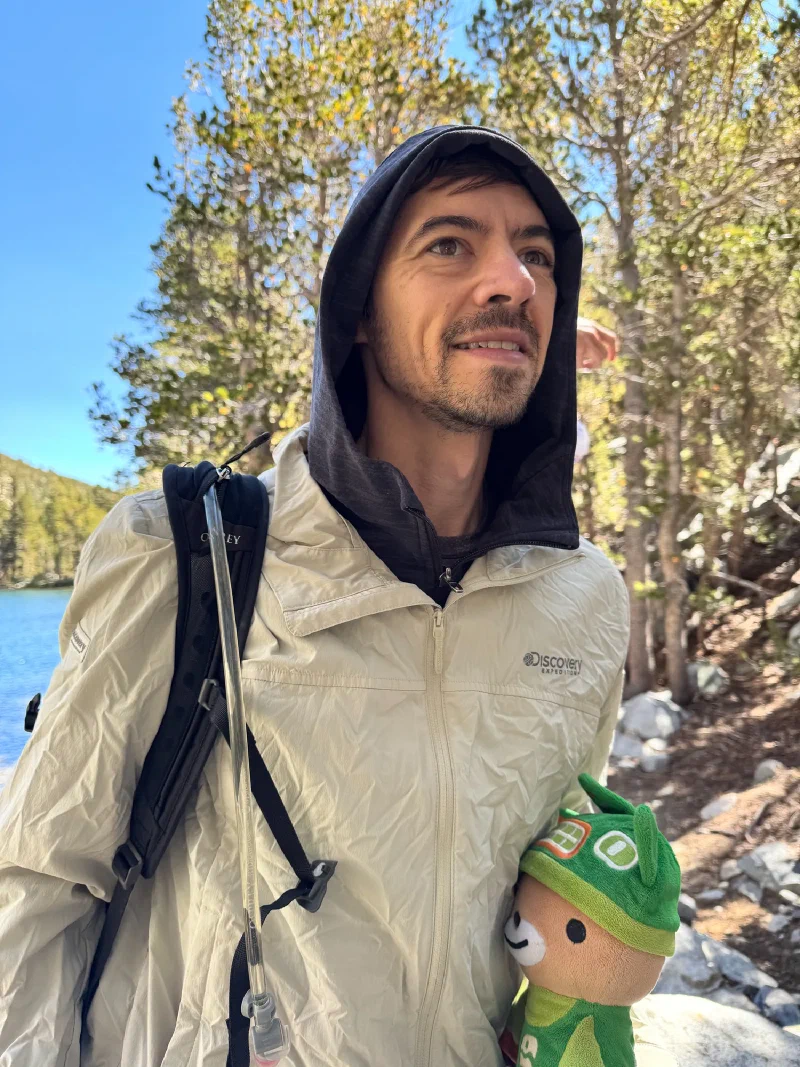 Close-up of Nicholas with Sumi peeking from his jacket