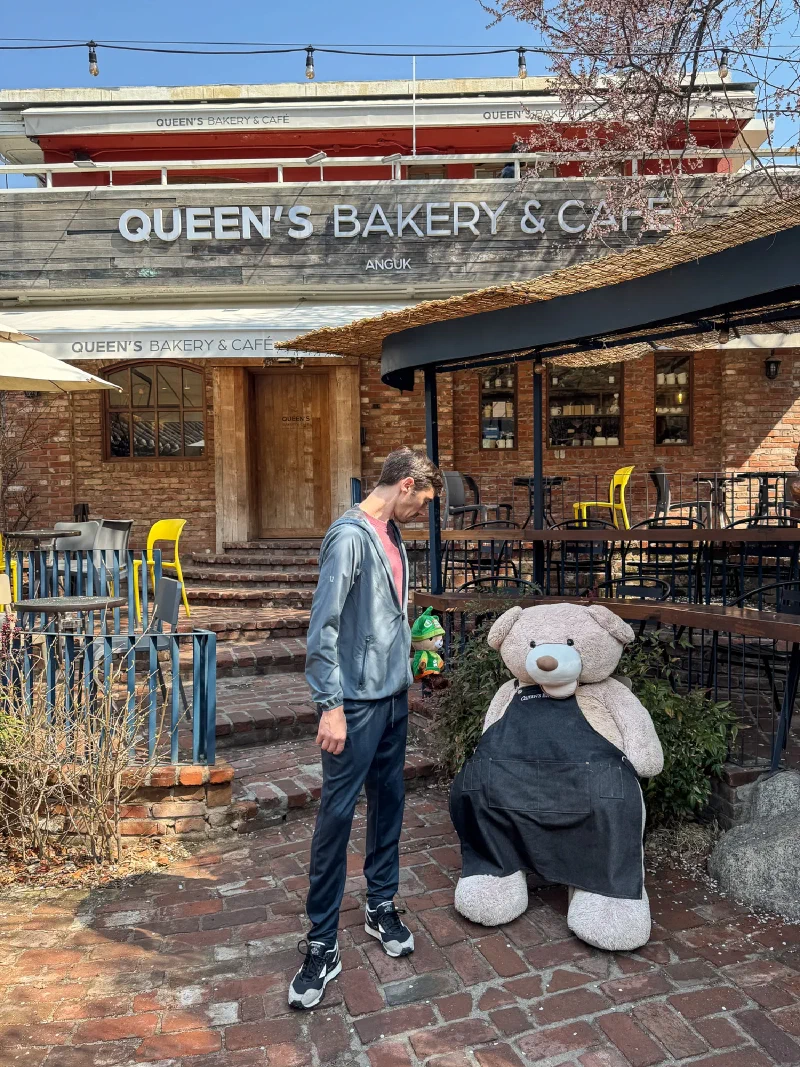 Queen's Bakery and Café in the Anguk neighborhood with a teddy bear statue