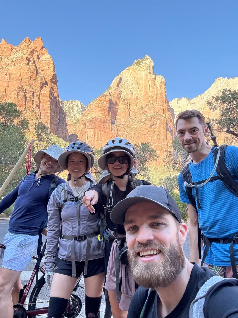 Group biking selfie with the Court of the Patriarchs