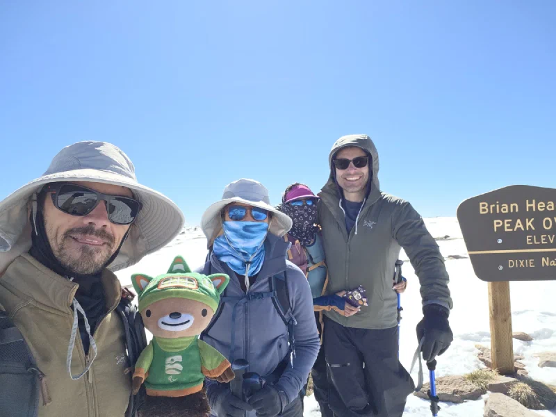 Group summit photo at Brian Head Peak with Nicholas, Pokin, Po On, Eric, and Sumi